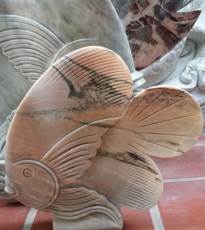 Statue of fish disc with ice water