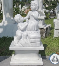 Stone statue of two white marble boy