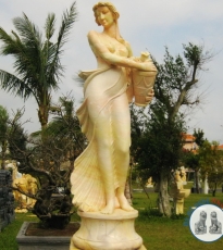 Statue of a girl holding a bottle