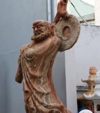 Statue of the monk hit the stone